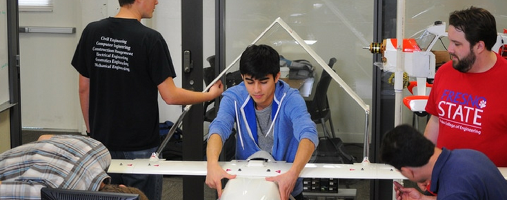 Students working on plane