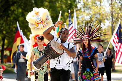 Fresno State students march during the cross cultural parade.