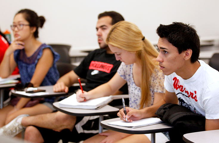 Students taking notes in class