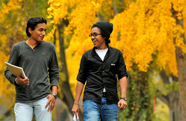 Two Students Walking and Talking