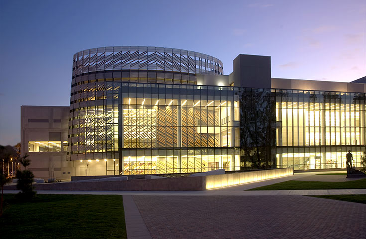 Night-time view of Henry Madden Library from outside