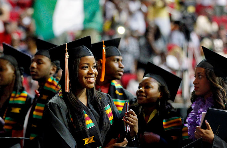 student smiling at graduation